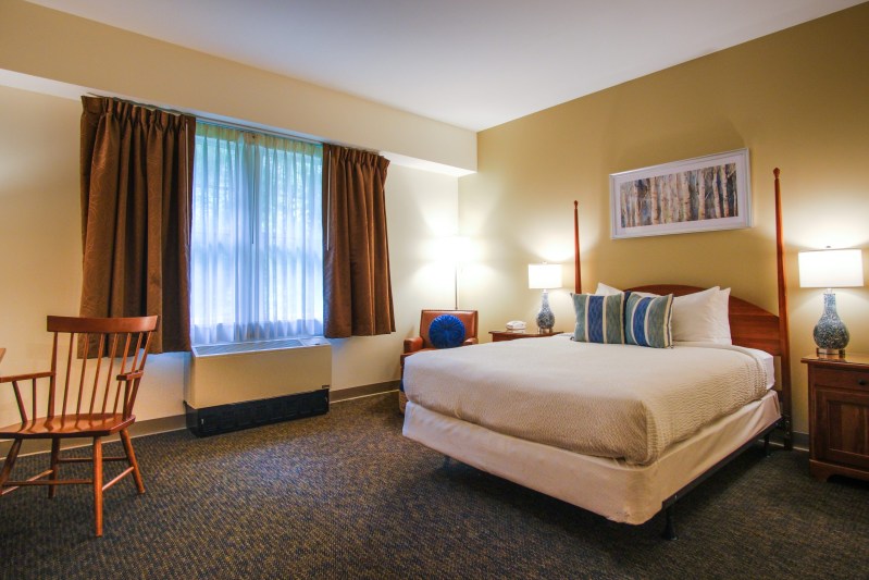 Cozy guest room at Warren Conference Center, event accommodations in Ashland, MA